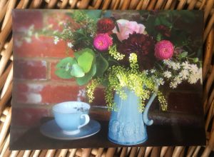 Informal arrangement of flowers in blue jug postcard for Bedgebury Blooms